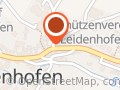 Helfende Assistenzhundepfoten im Grund